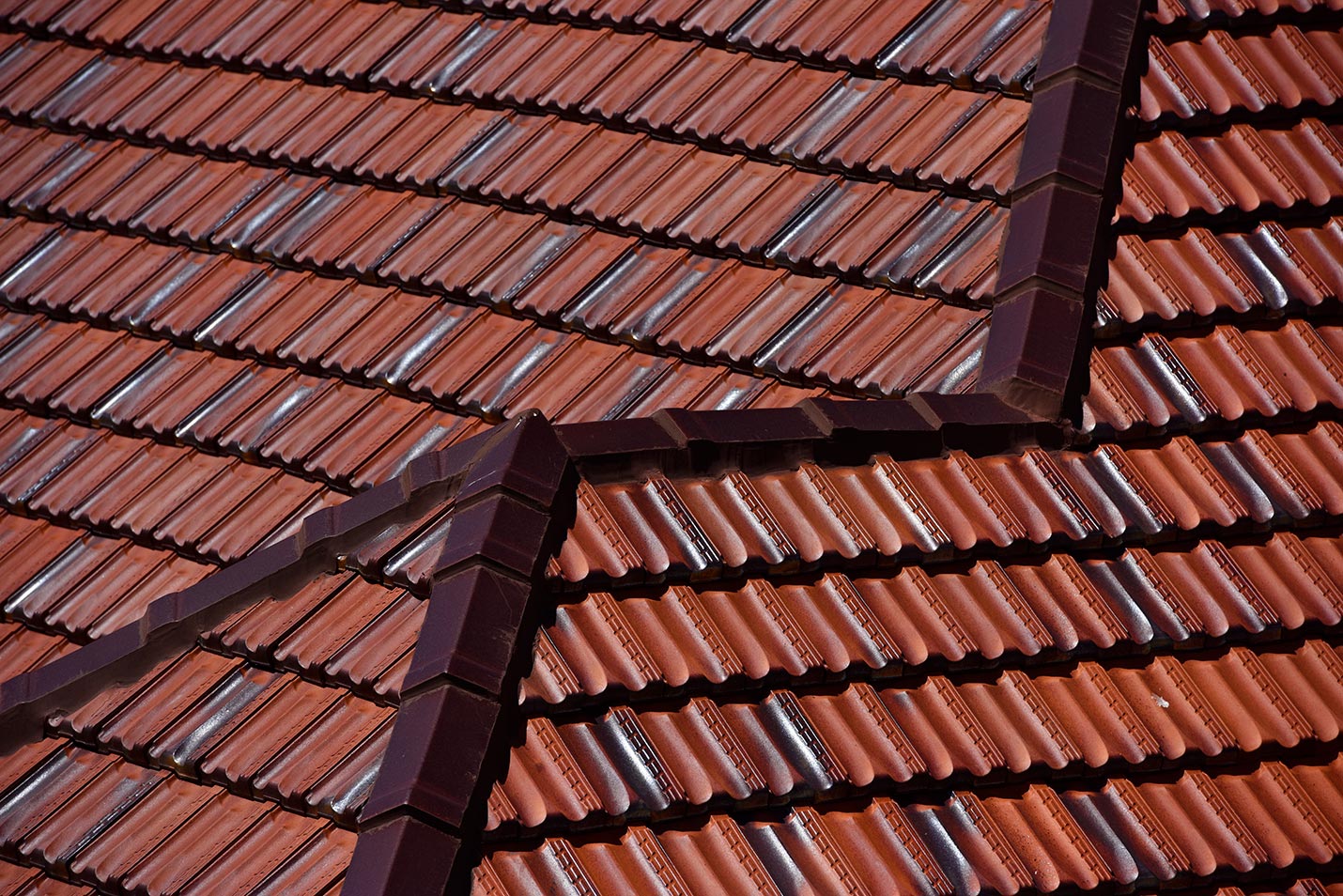 Close up view of the tile re-roof featuring Monier Terracotta tiles - Marseille in Aurora Gold.
